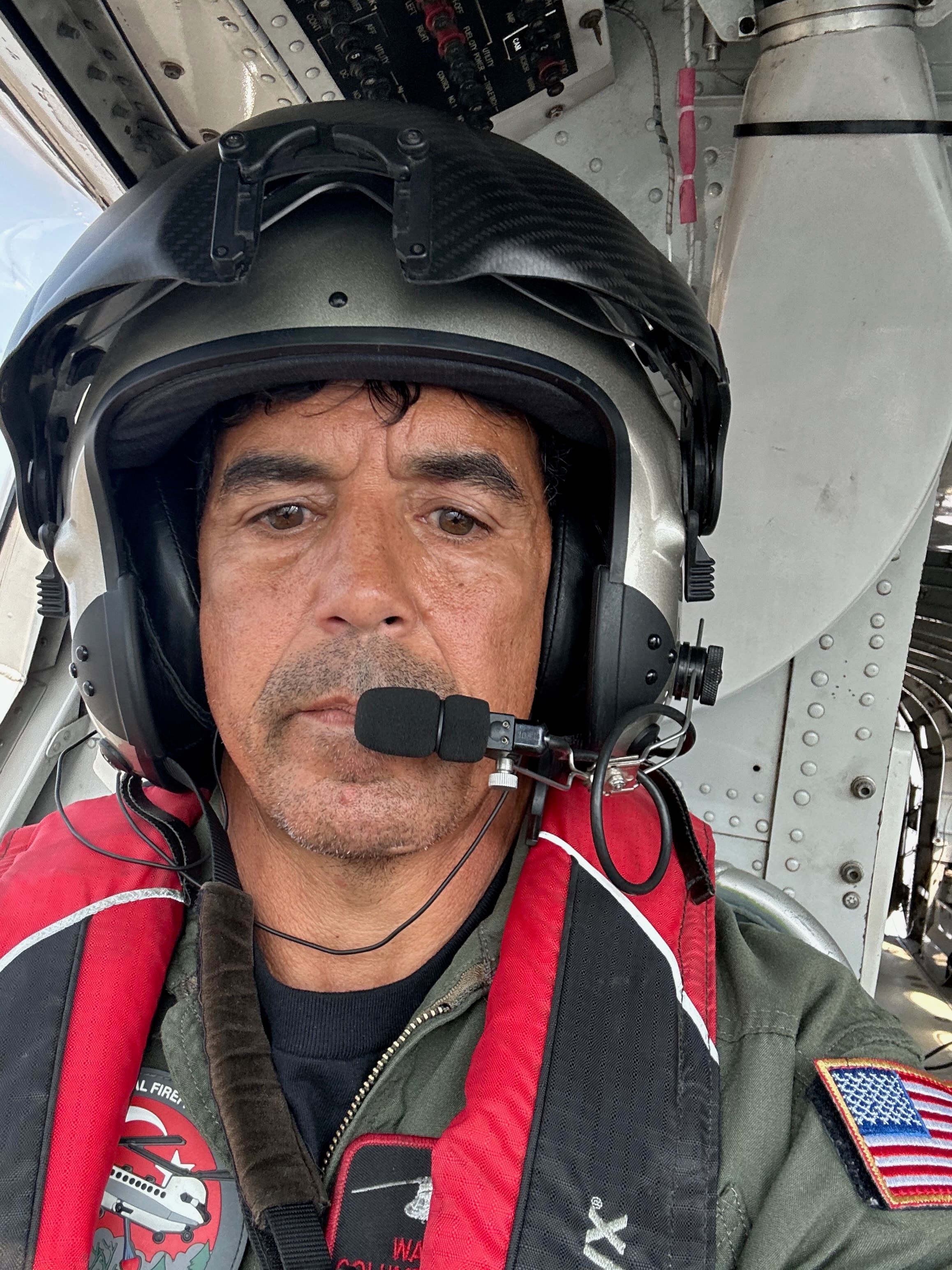 Wade in the cockpit of his helicopter