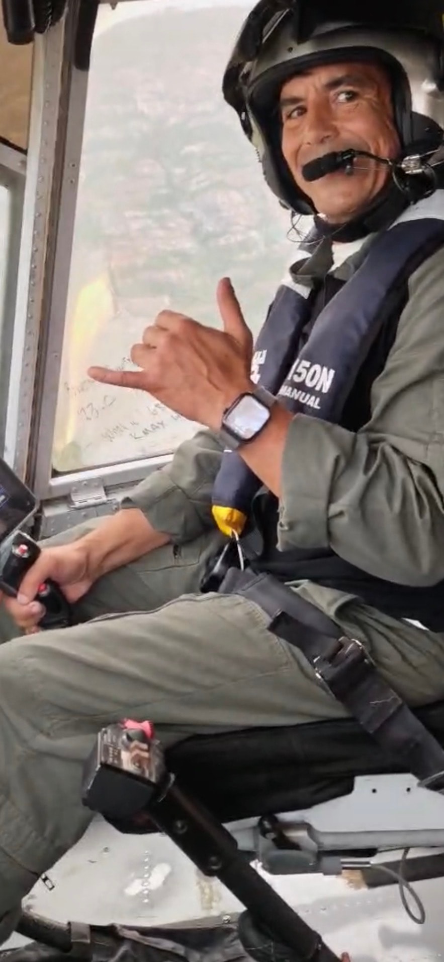 Pilot in helicopter cockpit aerial view
